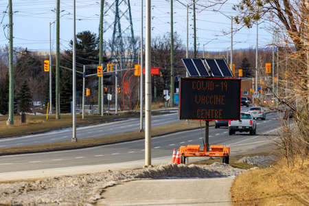 Ottawa, Ontario, Canada - March 14, 2021: An electronic marquee sign on Woodroofe Avenue approaching...