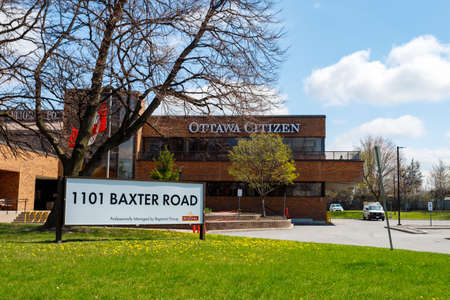 Ottawa, Ontario, Canada - April 18, 2021: Offices 1101 Baxter Road serve as headquarters for the Ottawa Citizen and Ottawa Sun, and an office of the National Post, for its tenant Postmedia Network.のeditorial素材