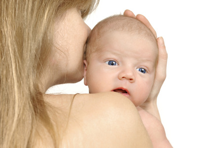 Mother holding little baby in her arms on white background, isolatedの写真素材