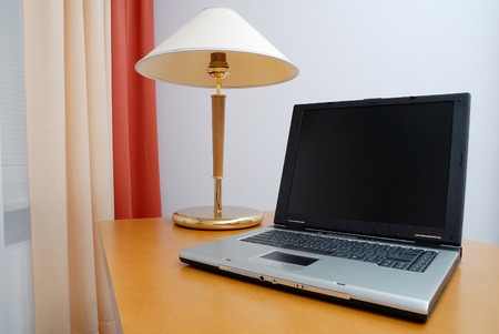 View of workplace in office. Laptop on desk.の写真素材