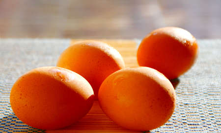 selective focus picture of some fresh eggs on bamboo weave pattern, close up soft focus backgroundの写真素材