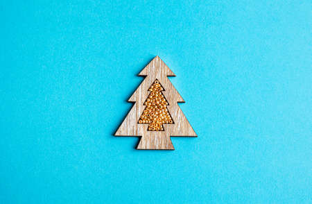 Decorative wooden hristmas tree on a blue background. Concept of Christmas, New Year, winter in...