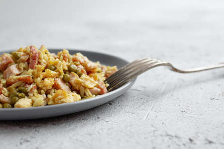 Homemade traditional Cantonese or Chinese fried rice on gray table close upの写真素材