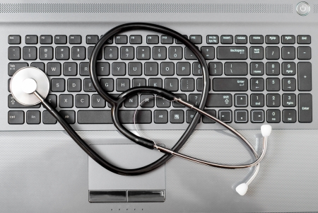 Stethoscope on laptop keyboardの写真素材