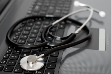Stethoscope on a computer keyboard