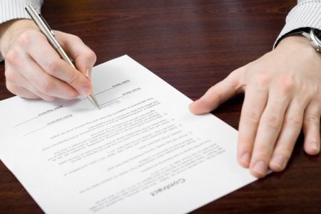 Signing contract by businessmanの写真素材