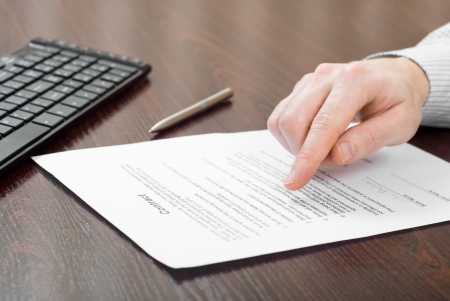 Business man reading contractの写真素材