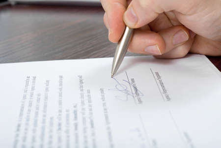 Close up shoot of signing some document