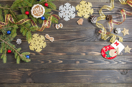 Background for Christmas menu. Cookie, fir and decoration on the old wooden table.の写真素材