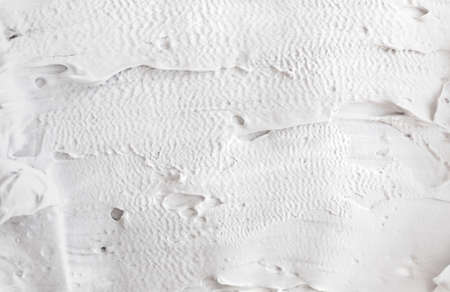 White abstract texture of surface with bold rough structure puttyの写真素材