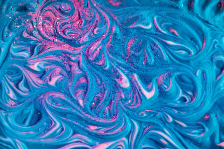 Fluid art liquid artistic abstract colorful background with foam texture and shimmering glittersの写真素材