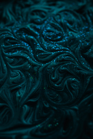 Smooth marbling mixed liquid paint texture with glitter. Abstract drammatic dark texture with fluid art effectの写真素材