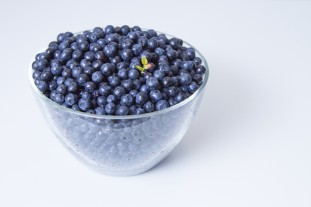 big cup of bilberry on the white tableの写真素材