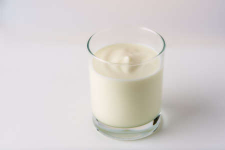 glass of yogurt on a white backgroundの写真素材
