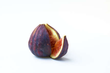 Ripe figs with a quarter cut outの写真素材