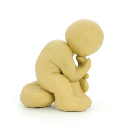 Yellow Plasticine  Man Thinking. Isolated on white.の写真素材