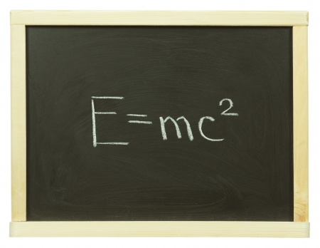 formula written on a blackboard with white chalkの写真素材