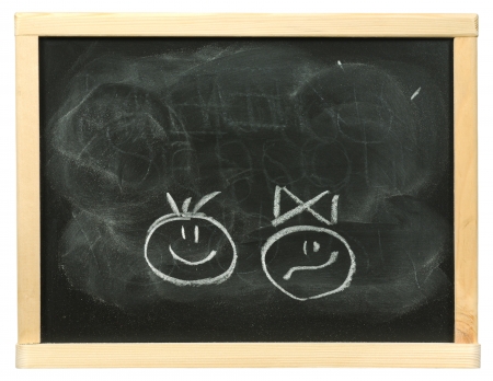 With a white chalk the drawn children on a boardの写真素材