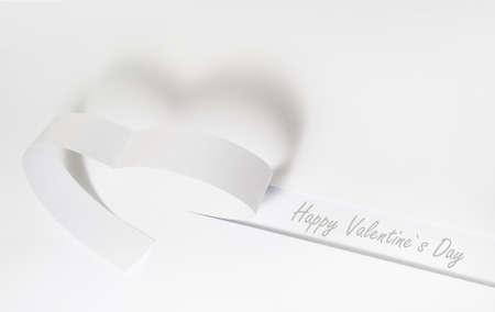 white beautiful paper heart with shadow, valentines day backgroundの写真素材