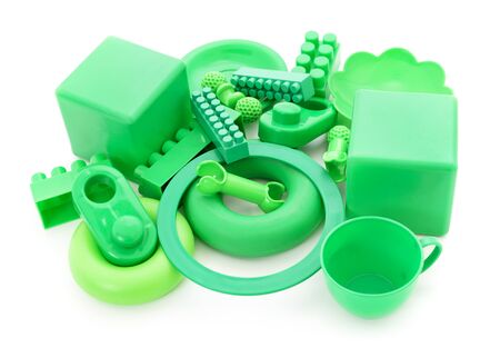 Green plastic toys on a white background