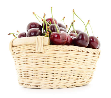 Ripe cherries in basket on a white background.の写真素材
