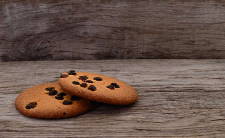 Cookies on dark brown old wooden table.の写真素材