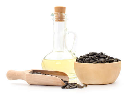 Sunflower seeds and oil. Isolated on white.の写真素材