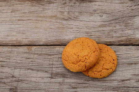 Cookies on dark brown old wooden table.