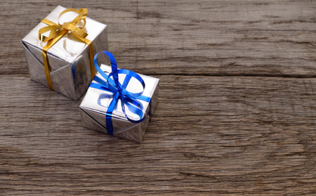 Gift boxes on wooden board background with space for text.の写真素材