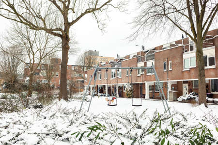 Dutch street covered in snow in Spijkenisse, the South Holland, the Netherlandsの写真素材
