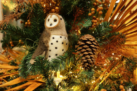 New Years toy owl on the christmas tree.の写真素材