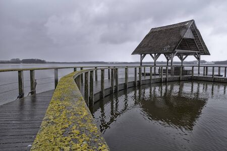 wood bridge over the lakeの写真素材