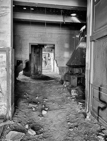 Black and white photo of the interior of abandoned companyの写真素材