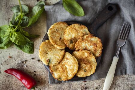 Vegetable fritters from cabbage on a wooden plate.の写真素材