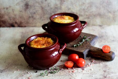 Rice with meat in clay pots on a gray backgroundの写真素材