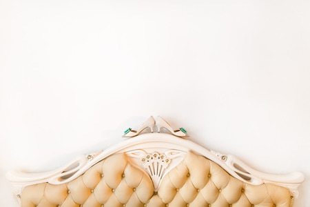 Bride's shoes on wedding day at the bed. Getting readyの写真素材