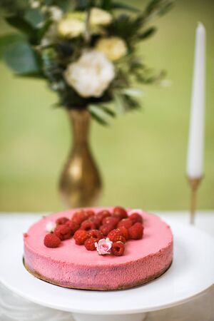 Cakes with raspberries and whipped cream on the plate.の写真素材