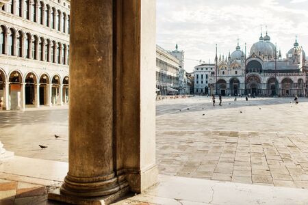 St. Marks Cathedral and square in Venice, doves and people.の写真素材