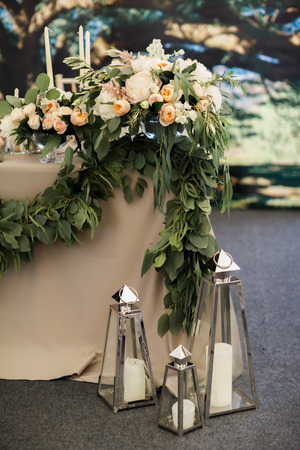Wedding table with colorful flowers and candles.の写真素材
