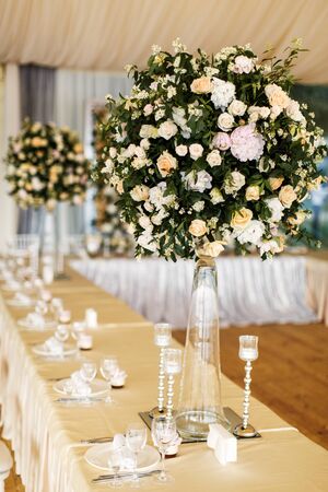 Table set for wedding with a beautiful flowers.