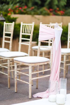 Rows of chairs for the guests at a wedding ceremony.の写真素材