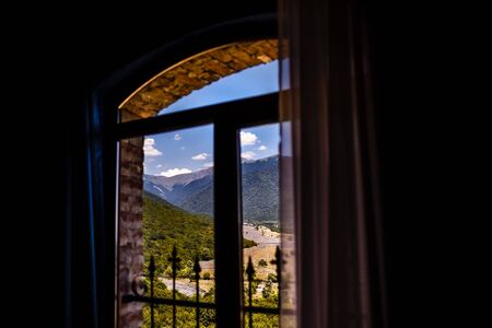 View through the window to the mountains.