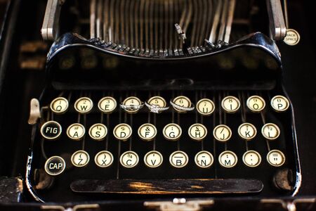 Three wedding rings on a typewriter. Wedding dayの写真素材