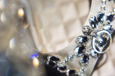 Wedding ring on the wedding shoes and highlights.の写真素材