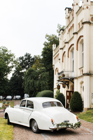 Vintage wedding car decorated with flowers. Wedding day.の写真素材