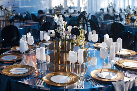 Rows of blue lamps in front of the entrance to the wedding party