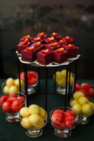 Rows of desserts and fruits on the wedding table.の写真素材
