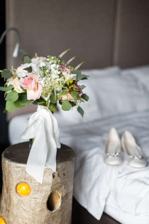 Colorful bouquet on vintage wooden table in the hotel room.の写真素材