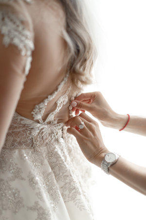 Hotel concierge holding the door for the bride.の写真素材