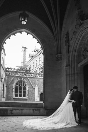 Hotel concierge holding the door for the bride.の写真素材